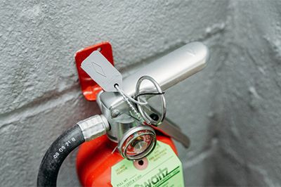 Close Up Of A Fire Extinguisher And Its Pin Thumb 